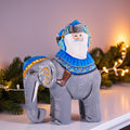 Hand‑carved Father Christmas — riding an elephant, 6.3″