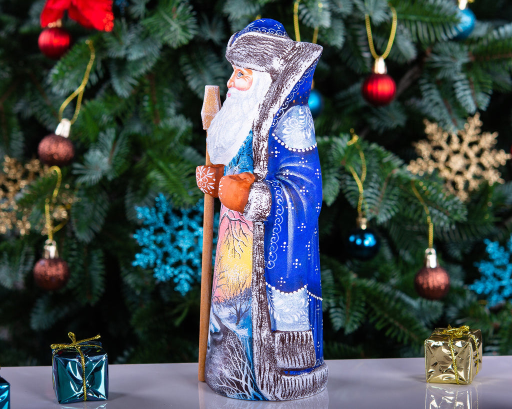 Hand carved wooden Santa figurine 9 inch, blue coat, winter landscape, holiday shelf decor