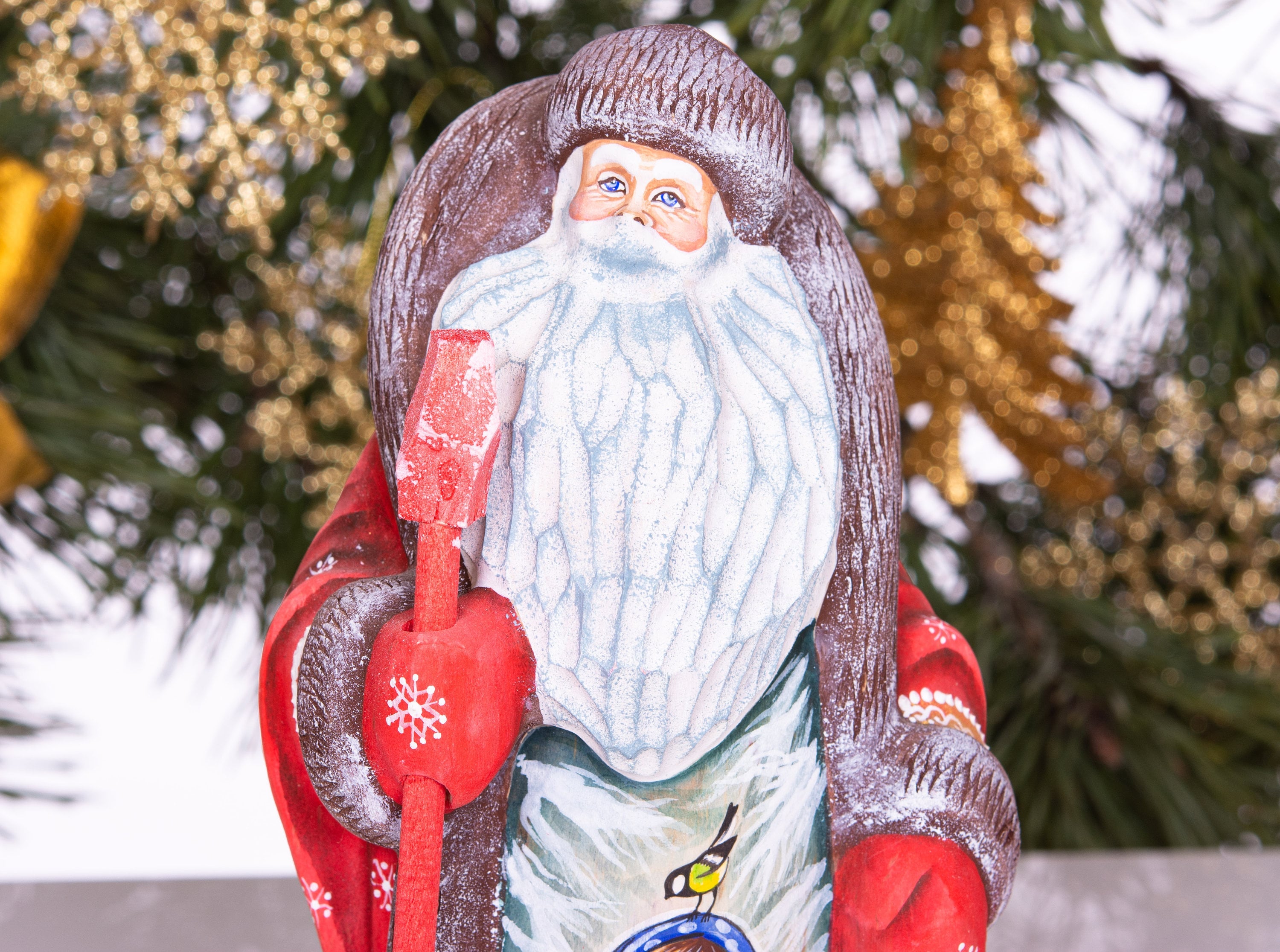 Old-World Santa wooden figurine 9.4 inch, winter child scene with bird, mantel display