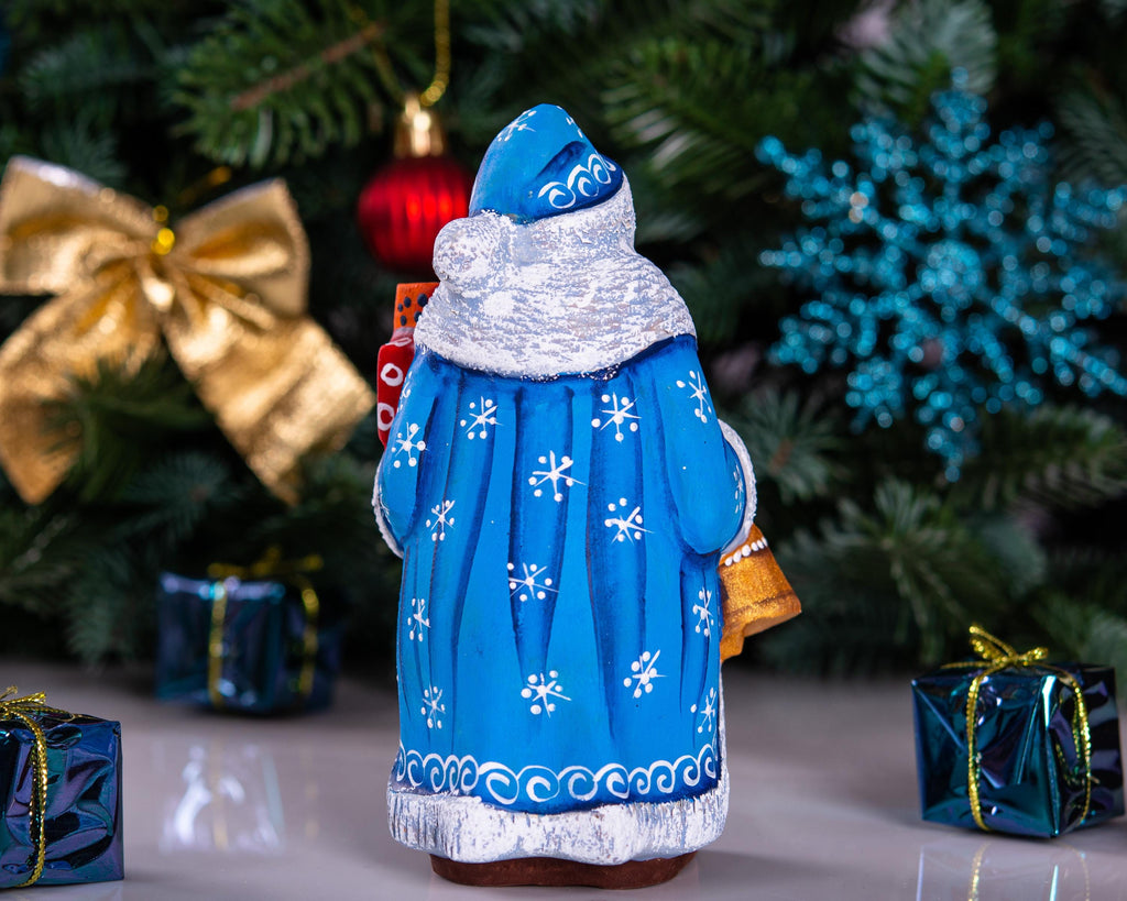 Blue Father Christmas figurine 5.5" with gold bell and stacked gifts