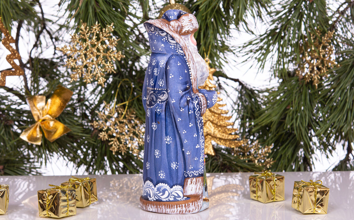 Hand carved and painted Santa 9 inch wooden figurine, snowy sledding scene, centerpiece