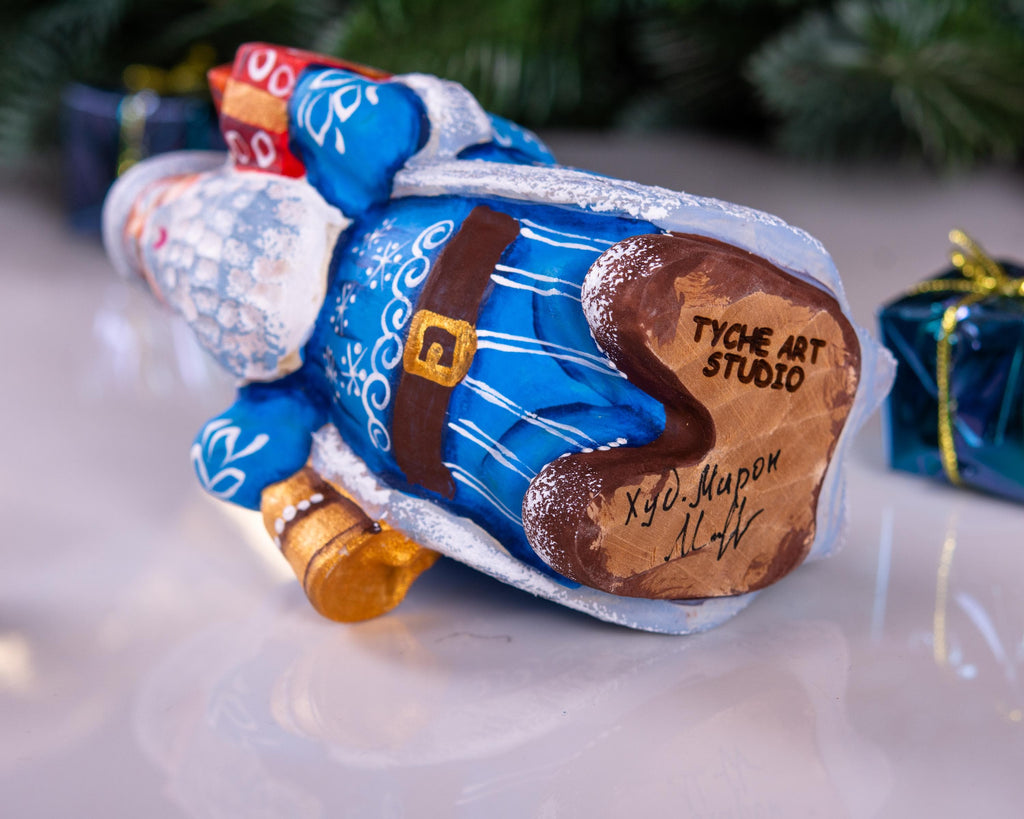 Blue Father Christmas figurine 5.5" with gold bell and stacked gifts
