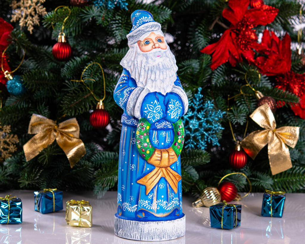 Blue Santa wood carving 11.5 inch, holding wreath, Christmas shelf or mantel decor