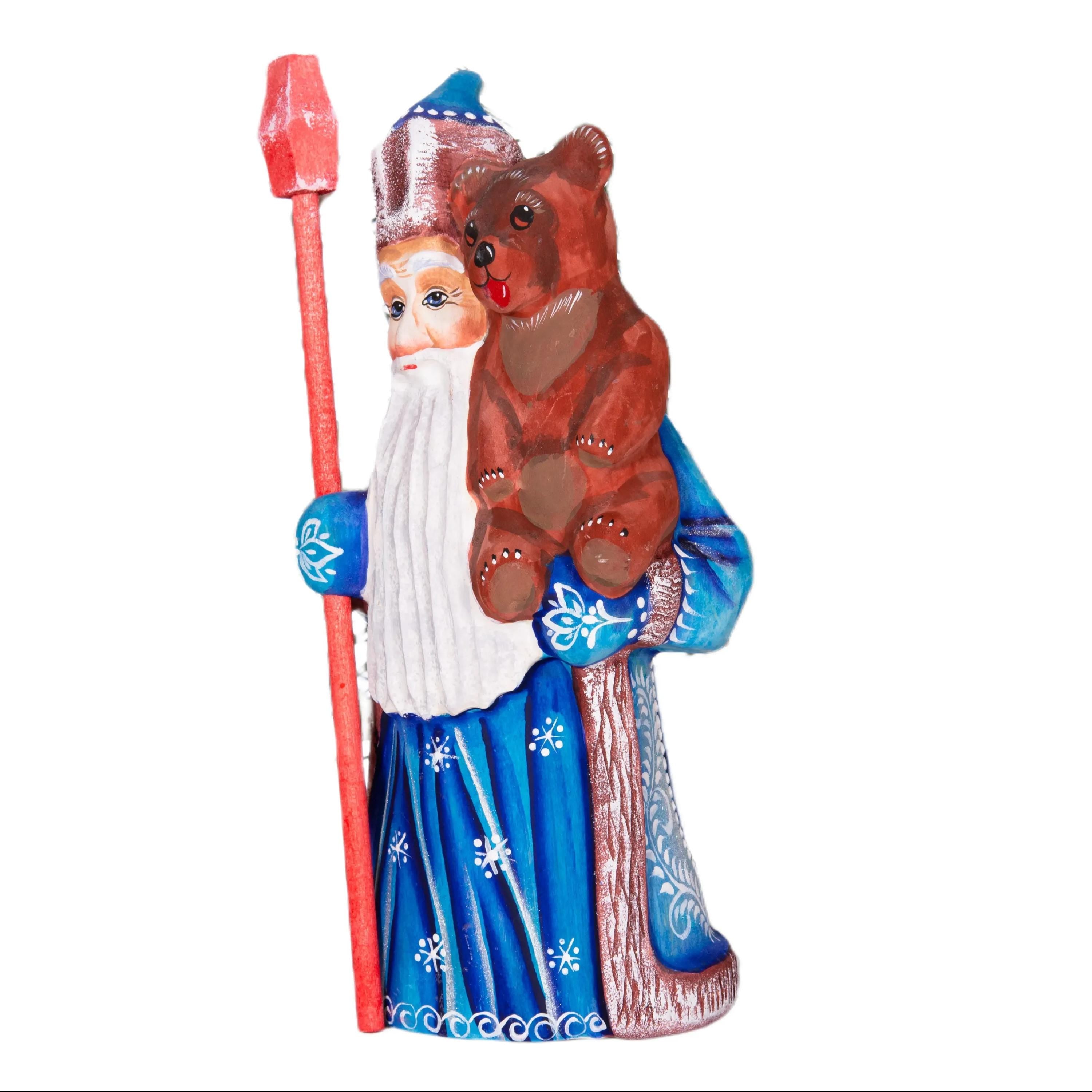 Old World Santa figurine 8.5 inch, carved wood, blue coat, holding bear, mantel display