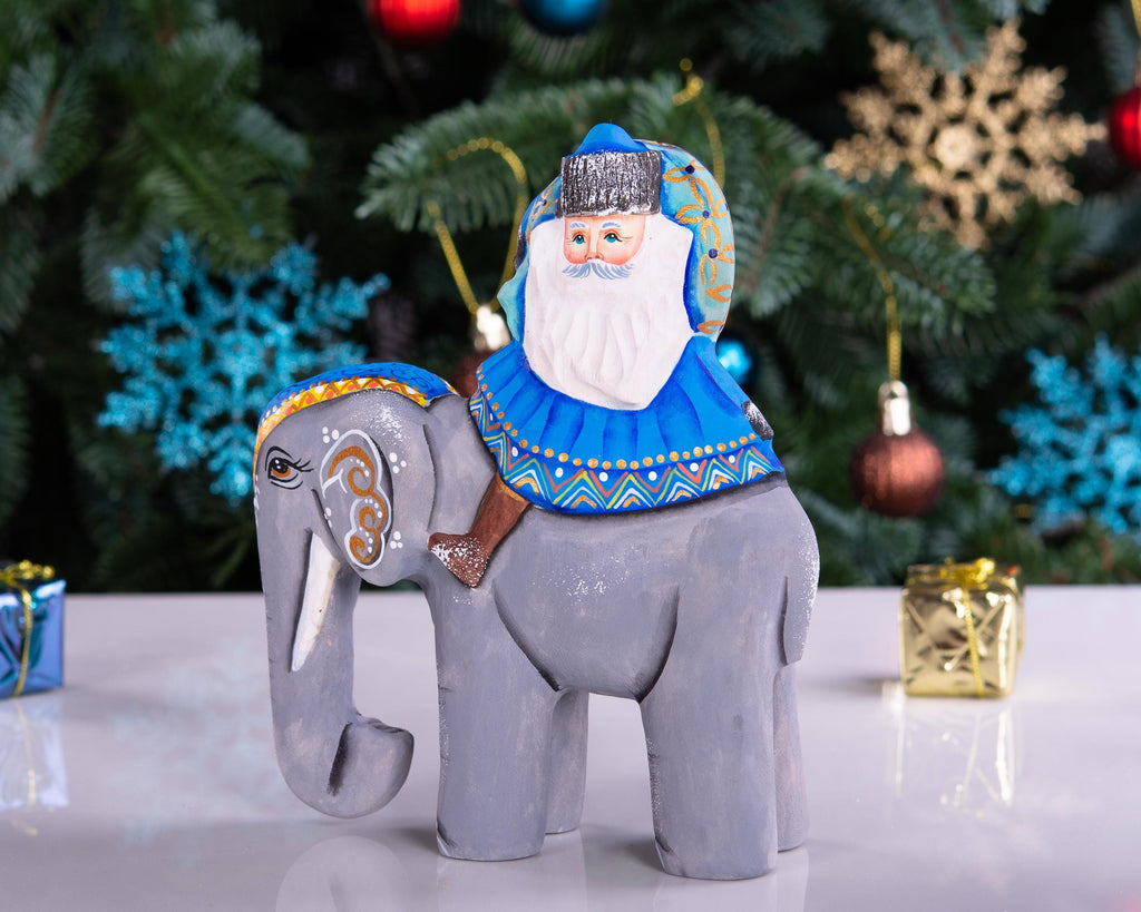 Hand‑carved Father Christmas — riding an elephant, 6.3″