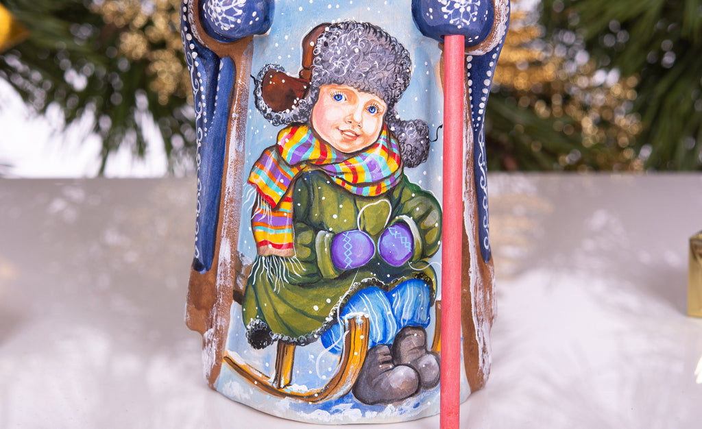 Hand carved and painted Santa 9 inch wooden figurine, snowy sledding scene, centerpiece