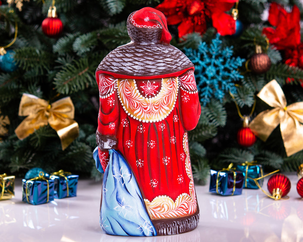 Hand carved wooden Santa figurine 9.5 inch, boy with sled, Christmas mantel decor
