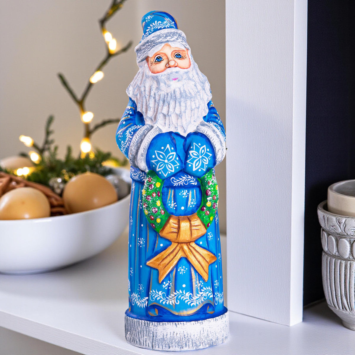 Blue Santa wood carving 11.5 inch, holding wreath, Christmas shelf or mantel decor