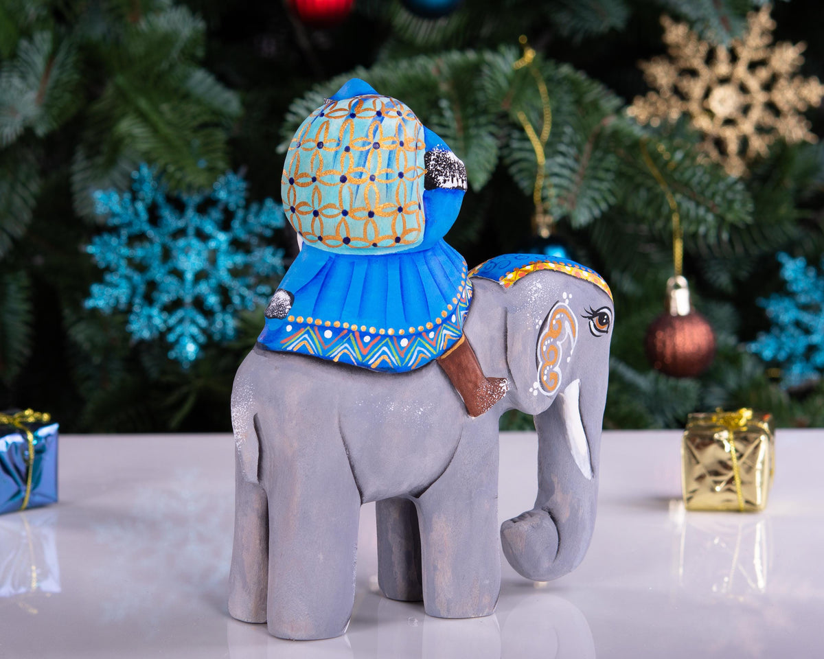 Hand‑carved Father Christmas — riding an elephant, 6.3″