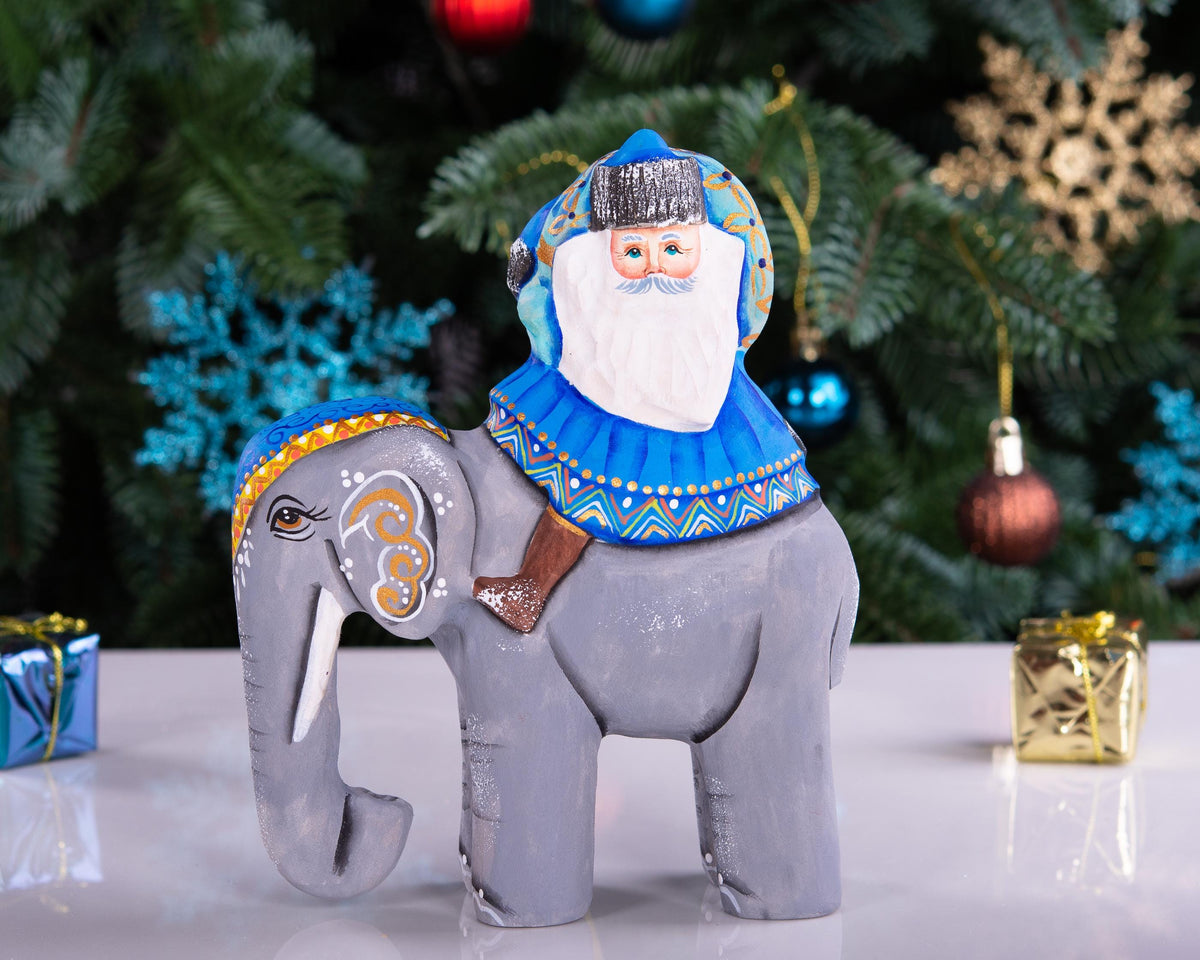 Hand‑carved Father Christmas — riding an elephant, 6.3″