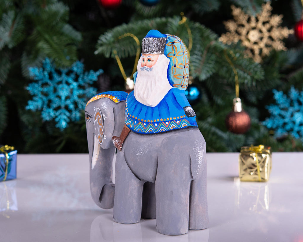 Hand‑carved Father Christmas — riding an elephant, 6.3″