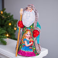 Santa figurine with staff, girl holding nutcracker, hand painted, 9.4 inch