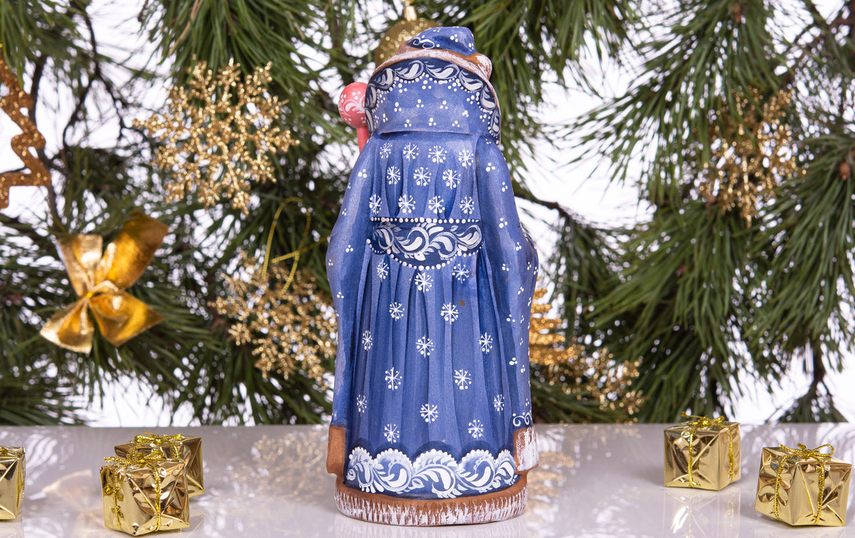 Hand carved and painted Santa 9 inch wooden figurine, snowy sledding scene, centerpiece