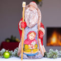 Father Christmas figurine, carved wood, folk art child scene, 9.4 inch