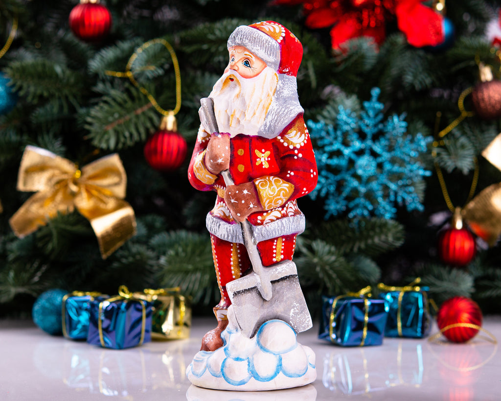Santa Figurine 7.1″, Hand‑Carved Wood, Snow Shovel, Gold Accents