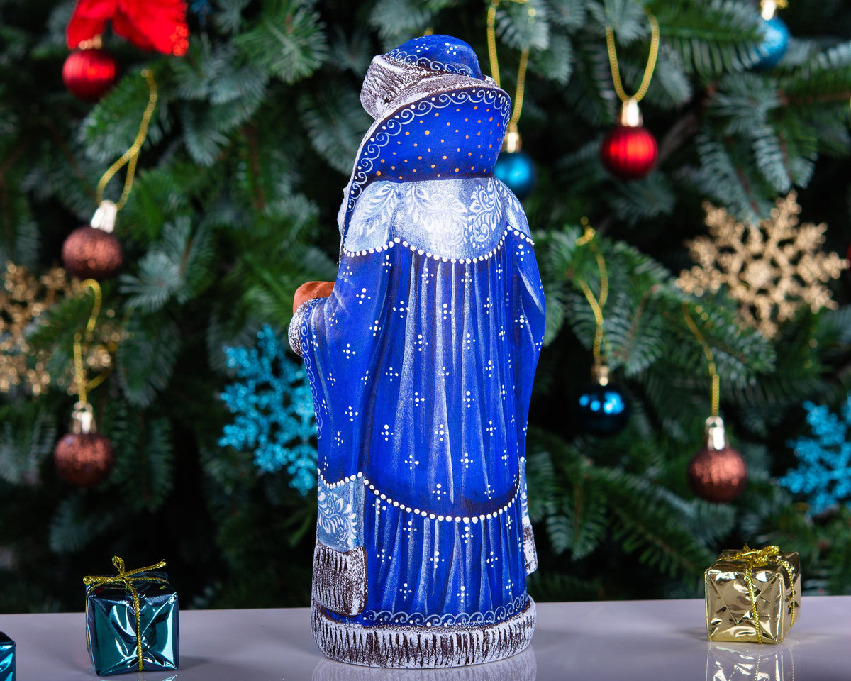 Hand carved wooden Santa figurine 9 inch, blue coat, winter landscape, holiday shelf decor