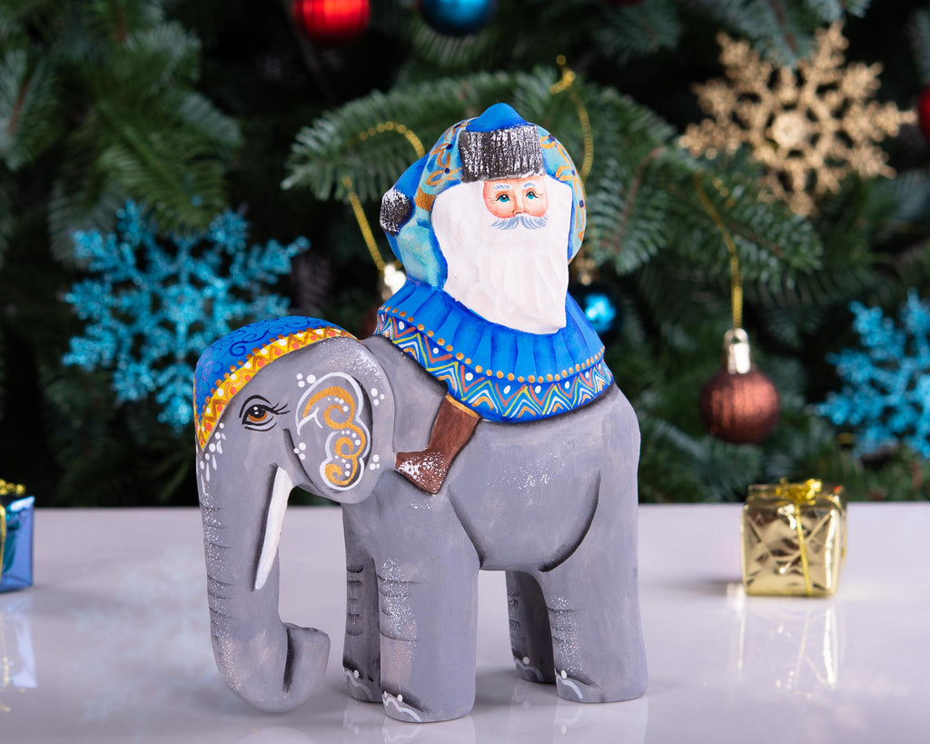 Hand‑carved Father Christmas — riding an elephant, 6.3″