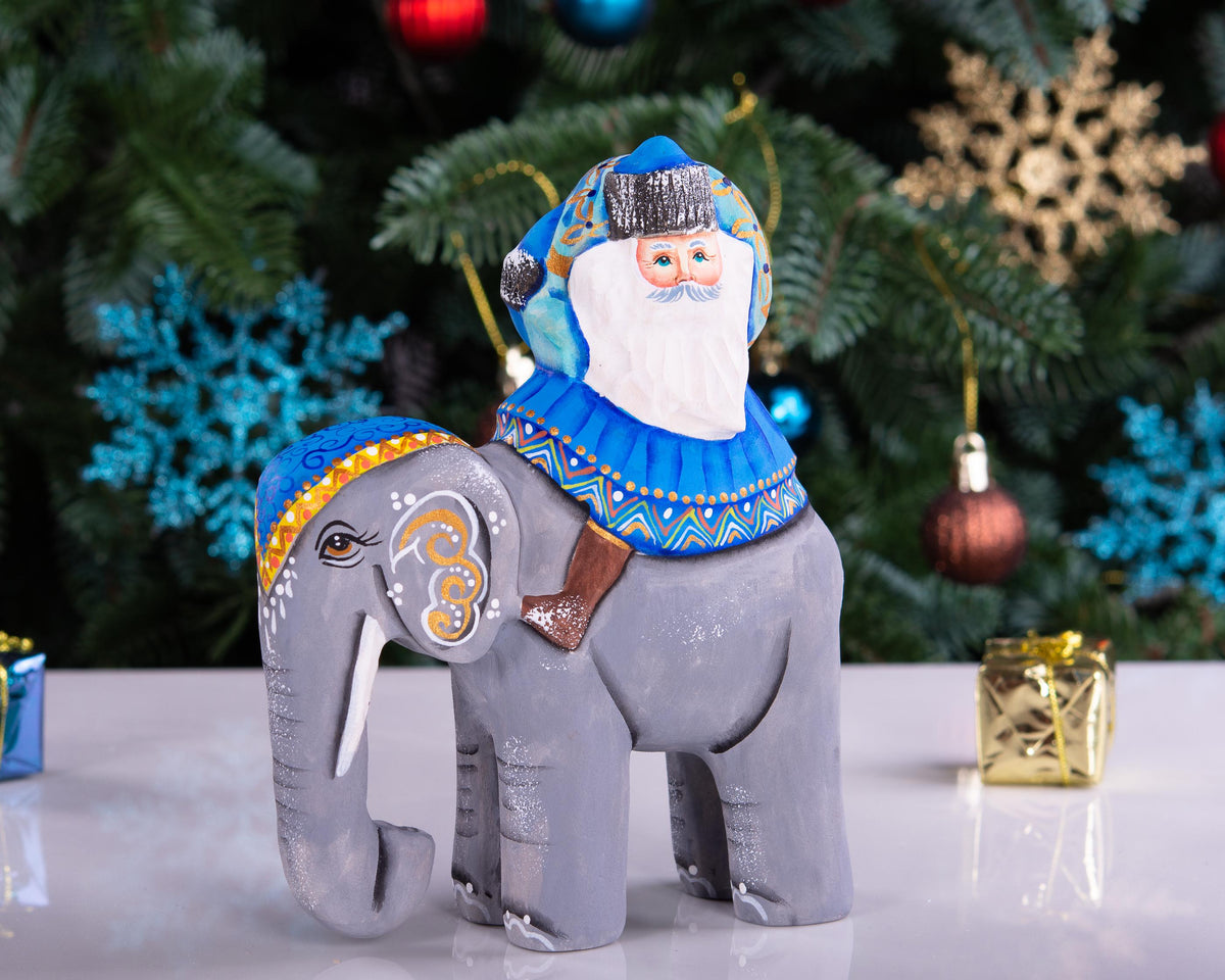 Hand‑carved Father Christmas — riding an elephant, 6.3″
