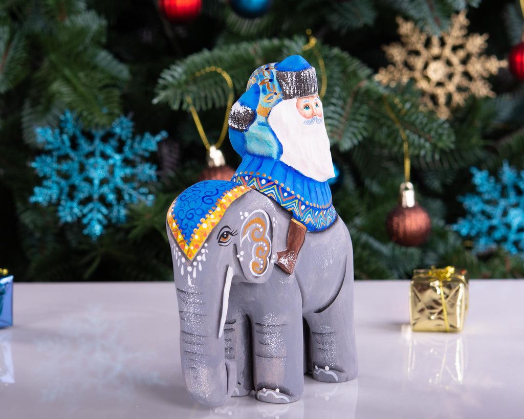 Hand‑carved Father Christmas — riding an elephant, 6.3″