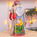 Vintage inspired Russian Santa carving 9.5 inch wooden figure, girl in mittens, Christmas display