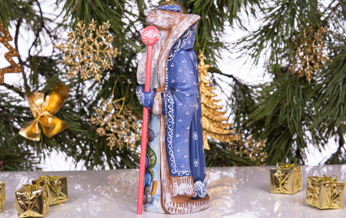 Hand carved and painted Santa 9 inch wooden figurine, snowy sledding scene, centerpiece