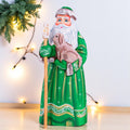 Hand carved Santa wooden figurine 8.7 inch, holding dog, green coat