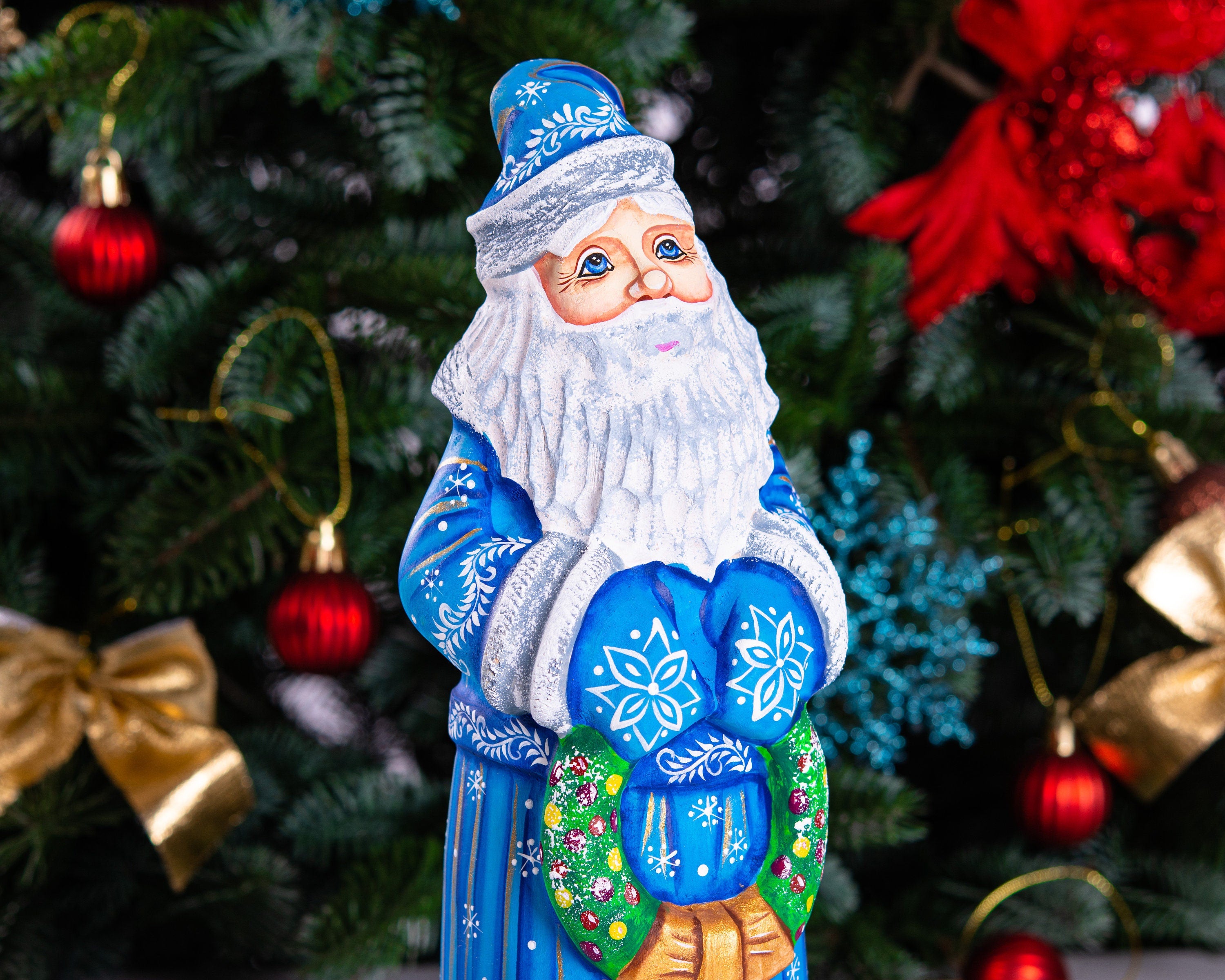 Blue Santa wood carving 11.5 inch, holding wreath, Christmas shelf or mantel decor