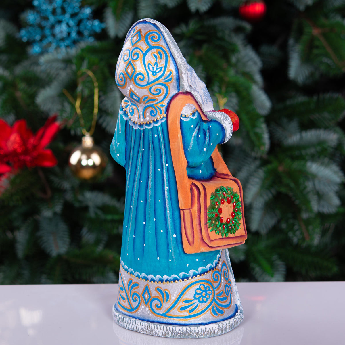 Kris Kringle solid wood figurine 9 inch, teal robe penguins, shelf decor