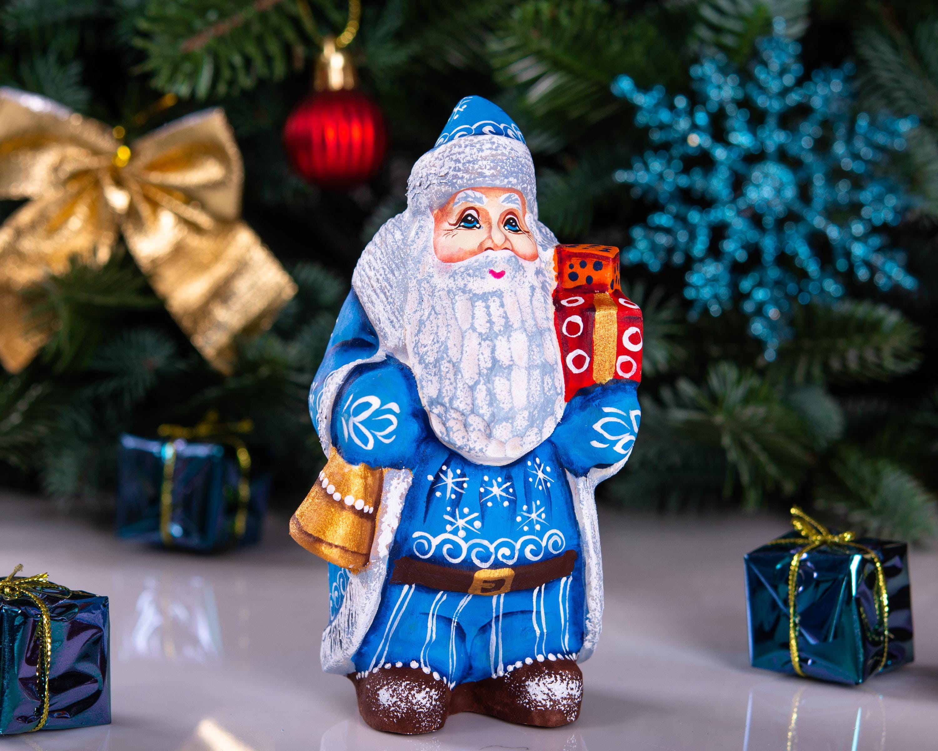 Blue Father Christmas figurine 5.5" with gold bell and stacked gifts