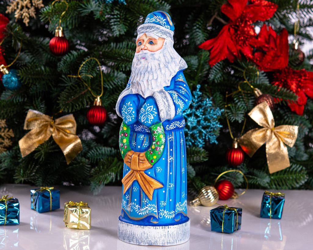 Blue Santa wood carving 11.5 inch, holding wreath, Christmas shelf or mantel decor