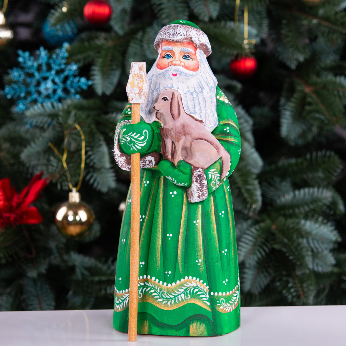 Hand carved Santa wooden figurine 8.7 inch, holding dog, green coat