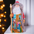 Collectible Santa figurine, folk art children and toys scene, 9.4 inch
