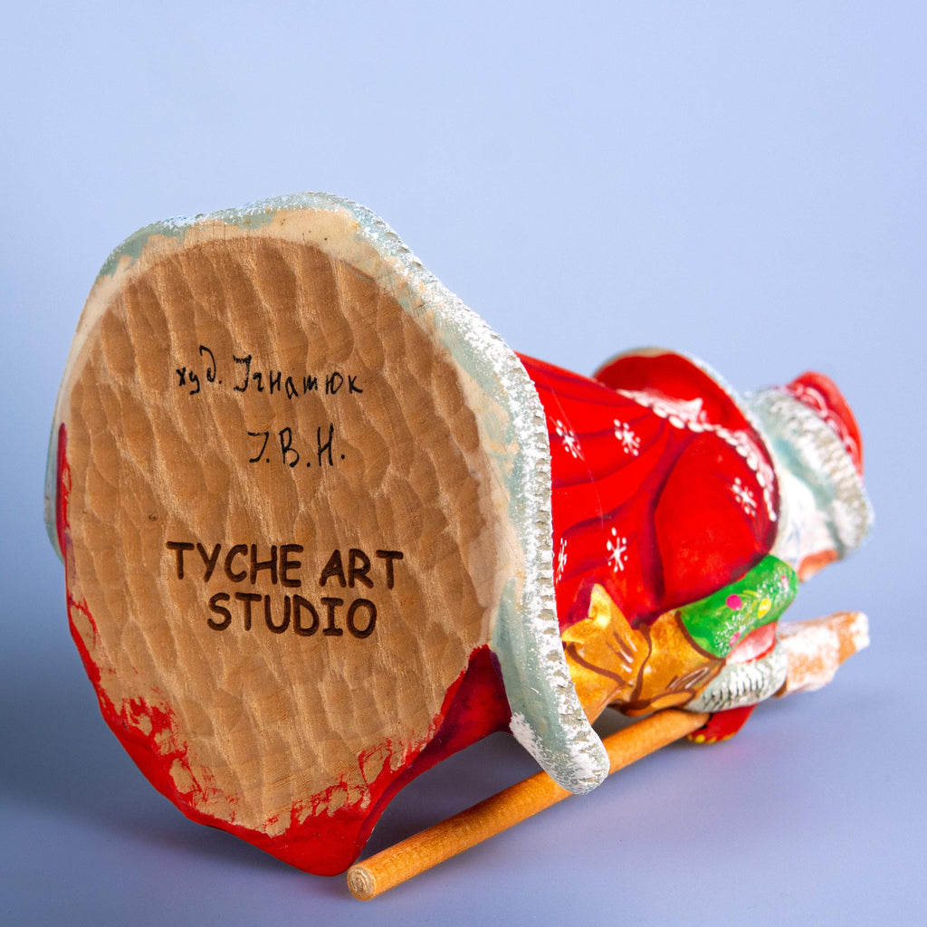 Father Christmas wooden figurine 7 inch, gift in hand, tabletop centerpiece, folk art