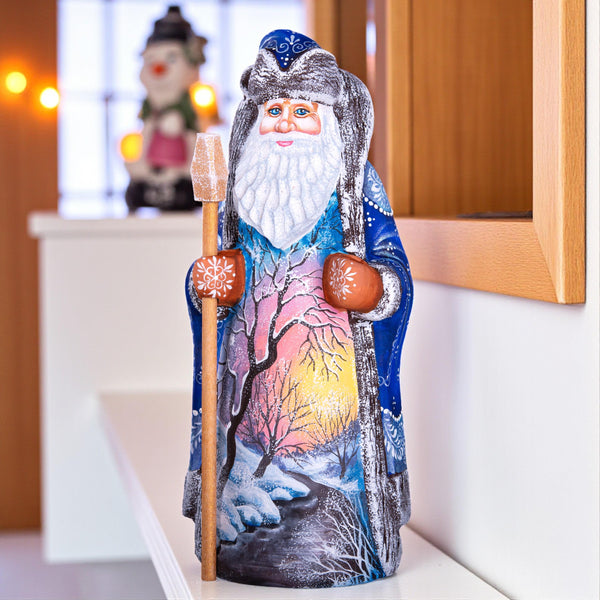 Hand carved wooden Santa figurine 9 inch, blue coat, winter landscape, holiday shelf decor