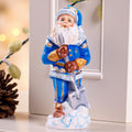 Father Christmas figurine with snow shovel in blue coat, 7.1 inch