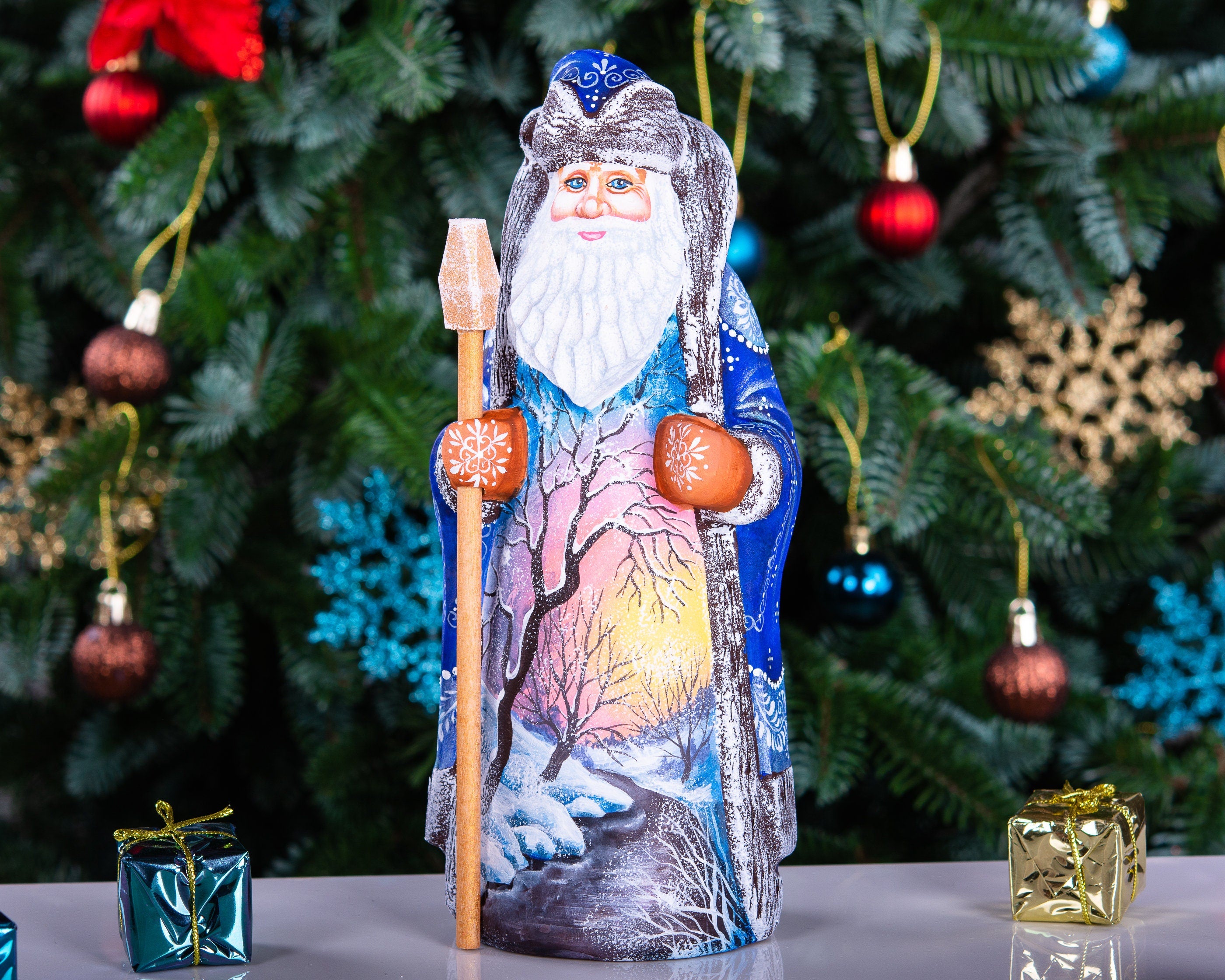 Hand carved wooden Santa figurine 9 inch, blue coat, winter landscape, holiday shelf decor