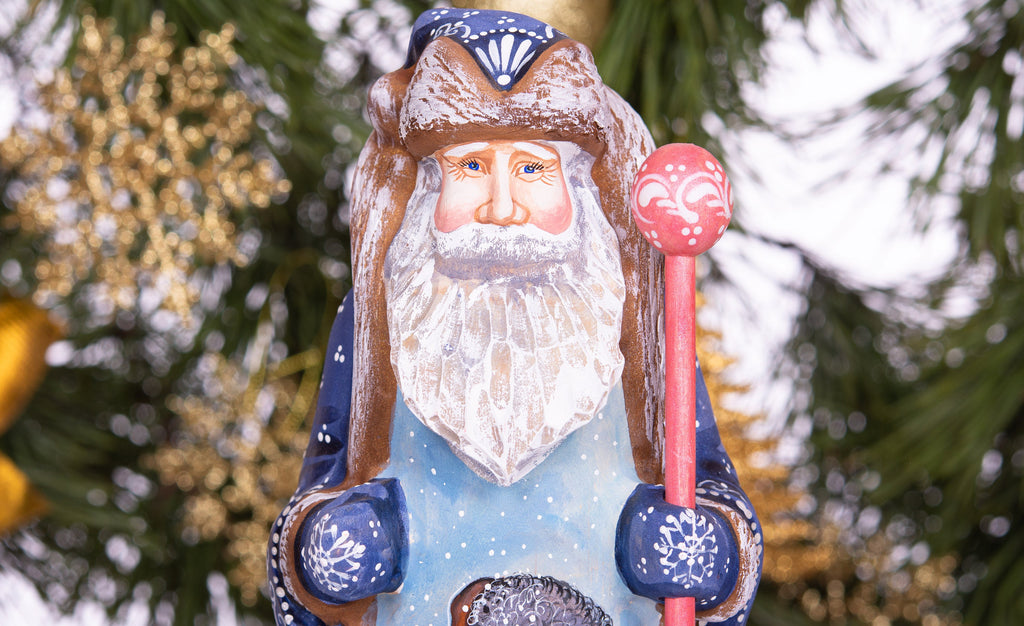 Hand carved and painted Santa 9 inch wooden figurine, snowy sledding scene, centerpiece