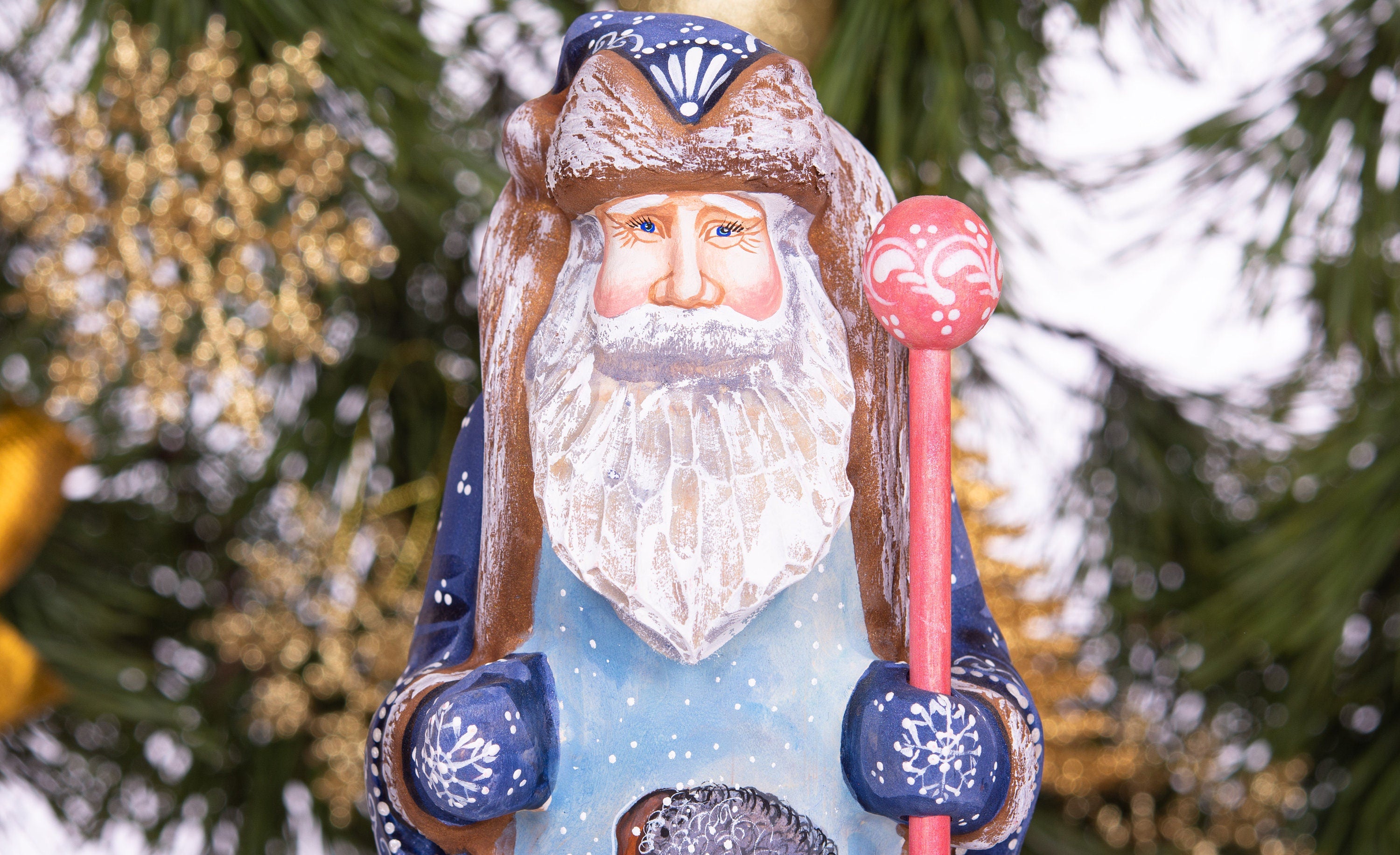 Hand carved and painted Santa 9 inch wooden figurine, snowy sledding scene, centerpiece