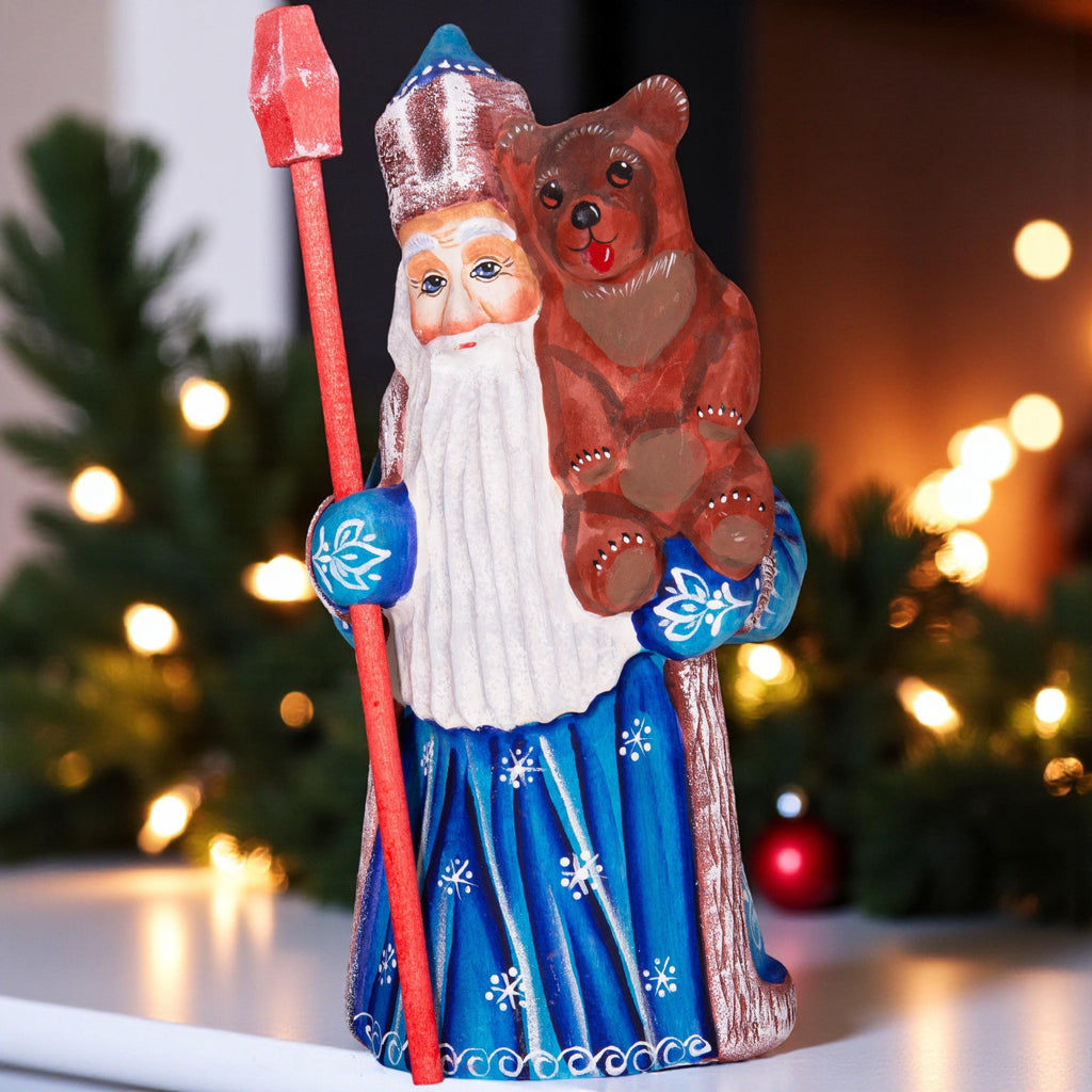 Old World Santa figurine 8.5 inch, carved wood, blue coat, holding bear, mantel display