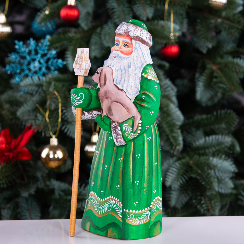 Hand carved Santa wooden figurine 8.7 inch, holding dog, green coat