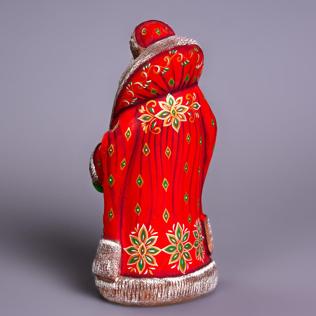 Santa Claus figurine 9.4 inch, folk art Santa reading by fireplace