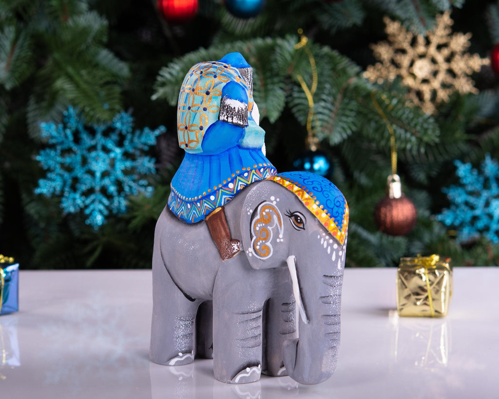Hand‑carved Father Christmas — riding an elephant, 6.3″
