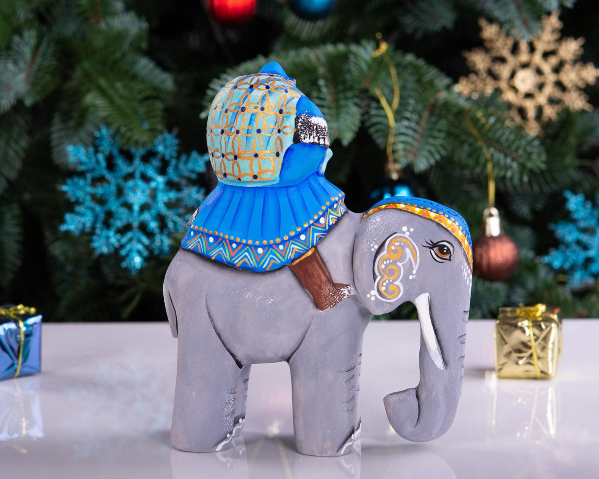 Hand‑carved Father Christmas — riding an elephant, 6.3″