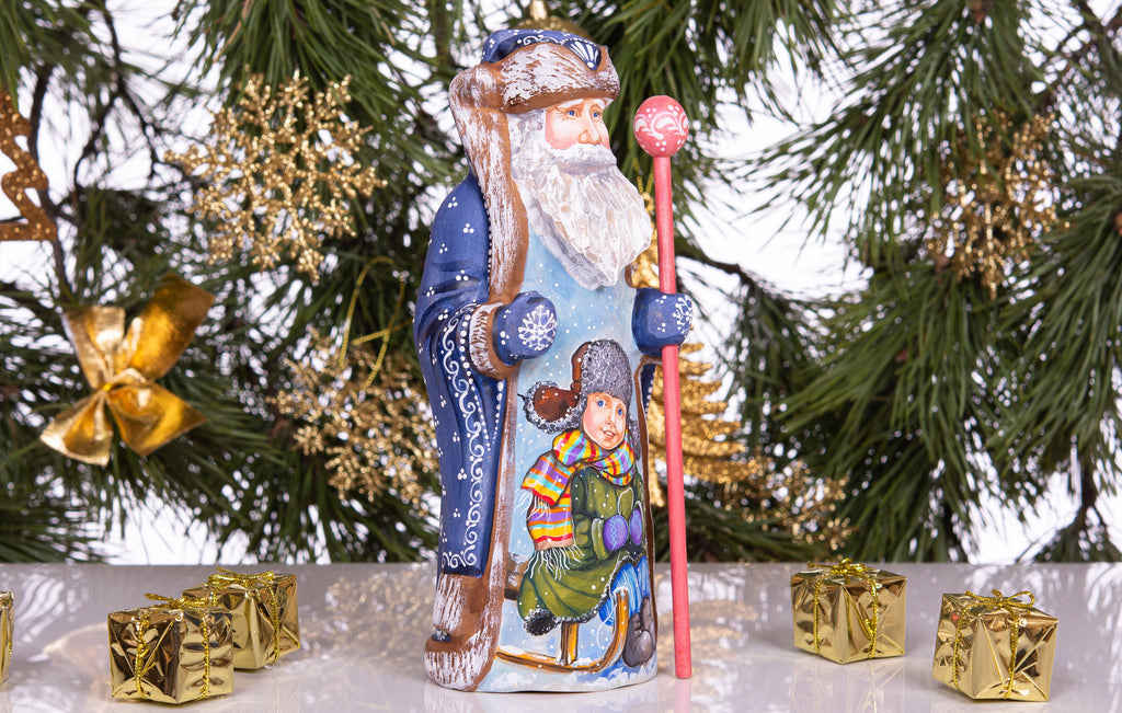 Hand carved and painted Santa 9 inch wooden figurine, snowy sledding scene, centerpiece