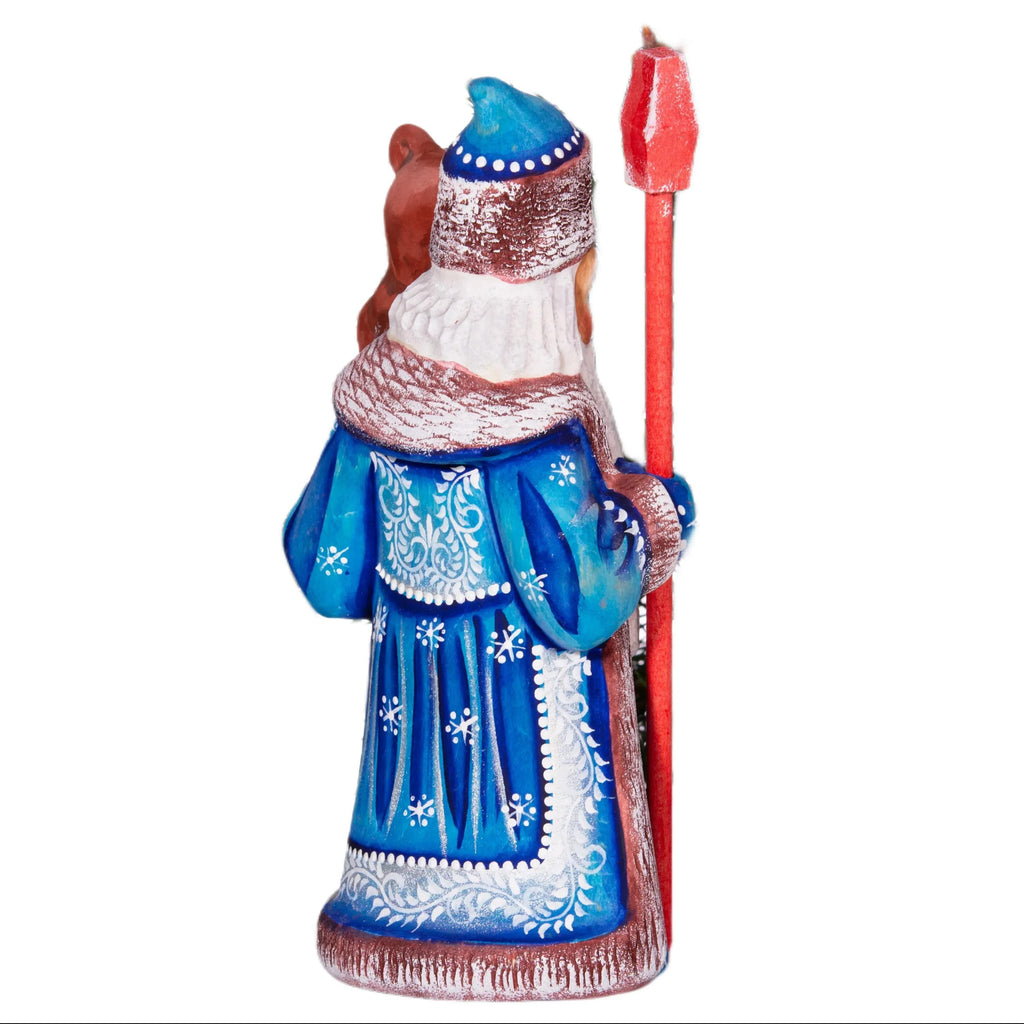 Old World Santa figurine 8.5 inch, carved wood, blue coat, holding bear, mantel display