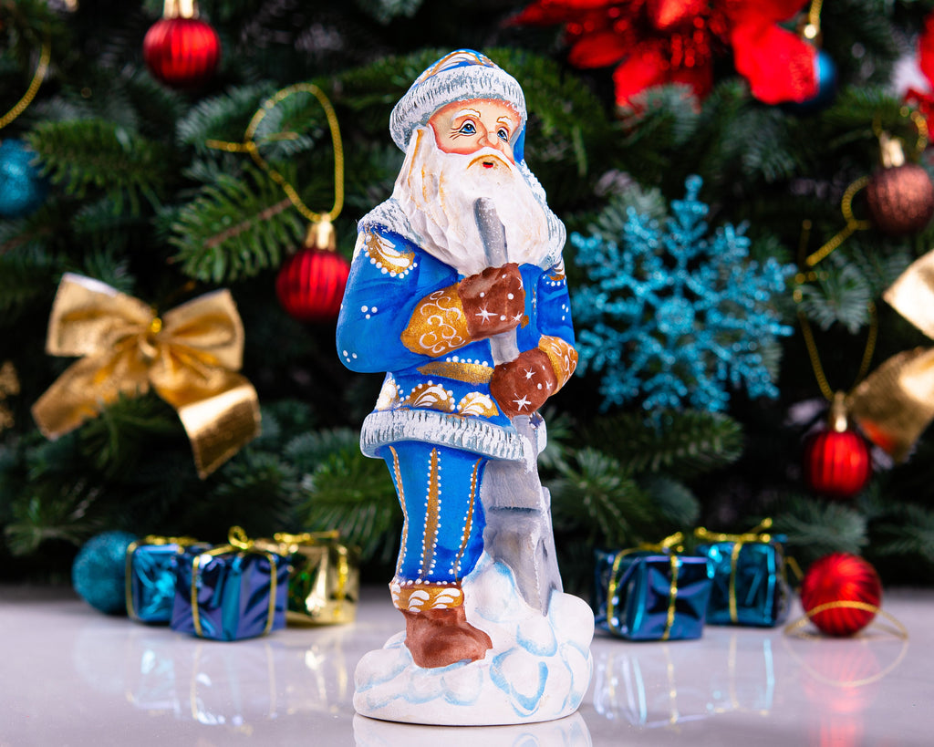 Father Christmas figurine with snow shovel in blue coat, 7.1 inch