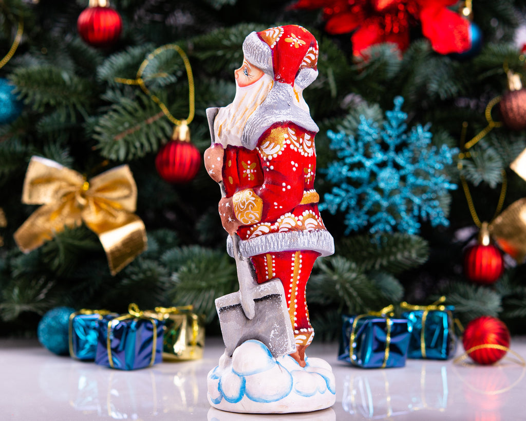 Santa Figurine 7.1″, Hand‑Carved Wood, Snow Shovel, Gold Accents