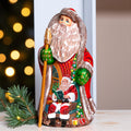 Santa Claus figurine 9.4 inch, folk art Santa reading by fireplace