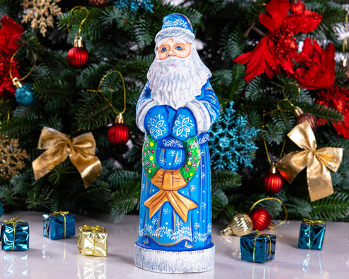 Blue Santa wood carving 11.5 inch, holding wreath, Christmas shelf or mantel decor