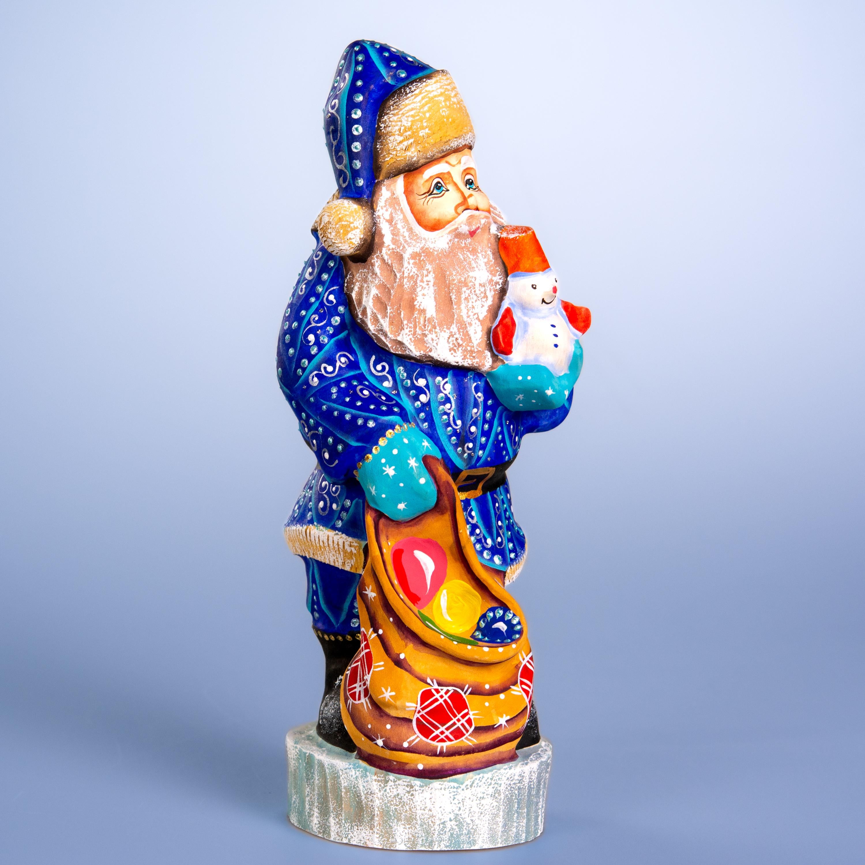 Hand carved blue Santa wooden figurine 10 inch, snowman in hand